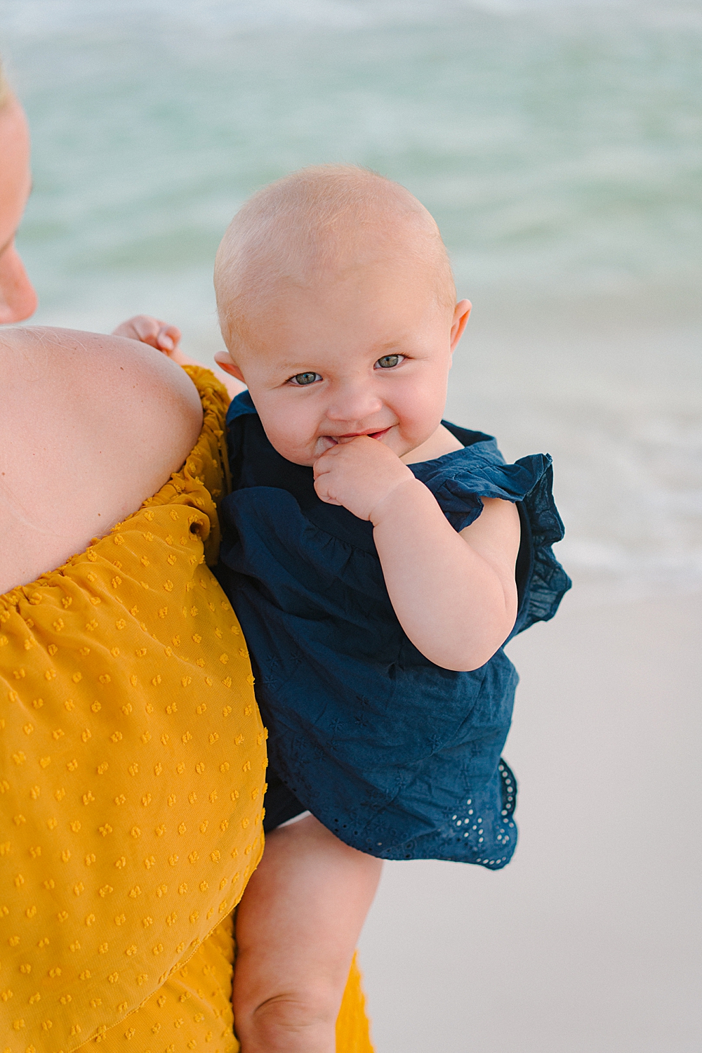 baby on the beach during family photo session in destin fl area