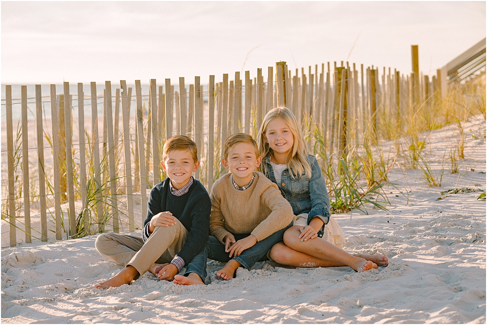 kids sitting in the sand at family-friendly beaches in Destin and 30A